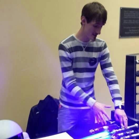 Showing builds at a convention table with a lit blue laser in front of me